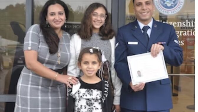 Then Airman 1st Class Yosry Zaki, celebrates with his wife and daughters after taking the Naturalization Oath of Allegiance to the United States of America during a ceremony in Montgomery, Ala., Nov. 15, 2023. Zaki, now a Senior Airman, is a flight services technician in the 908th Aeromedical Evacuation Squadron at Maxwell Air Force Base, Ala. (U.S. Air Force photo by Bradley J. Clark)